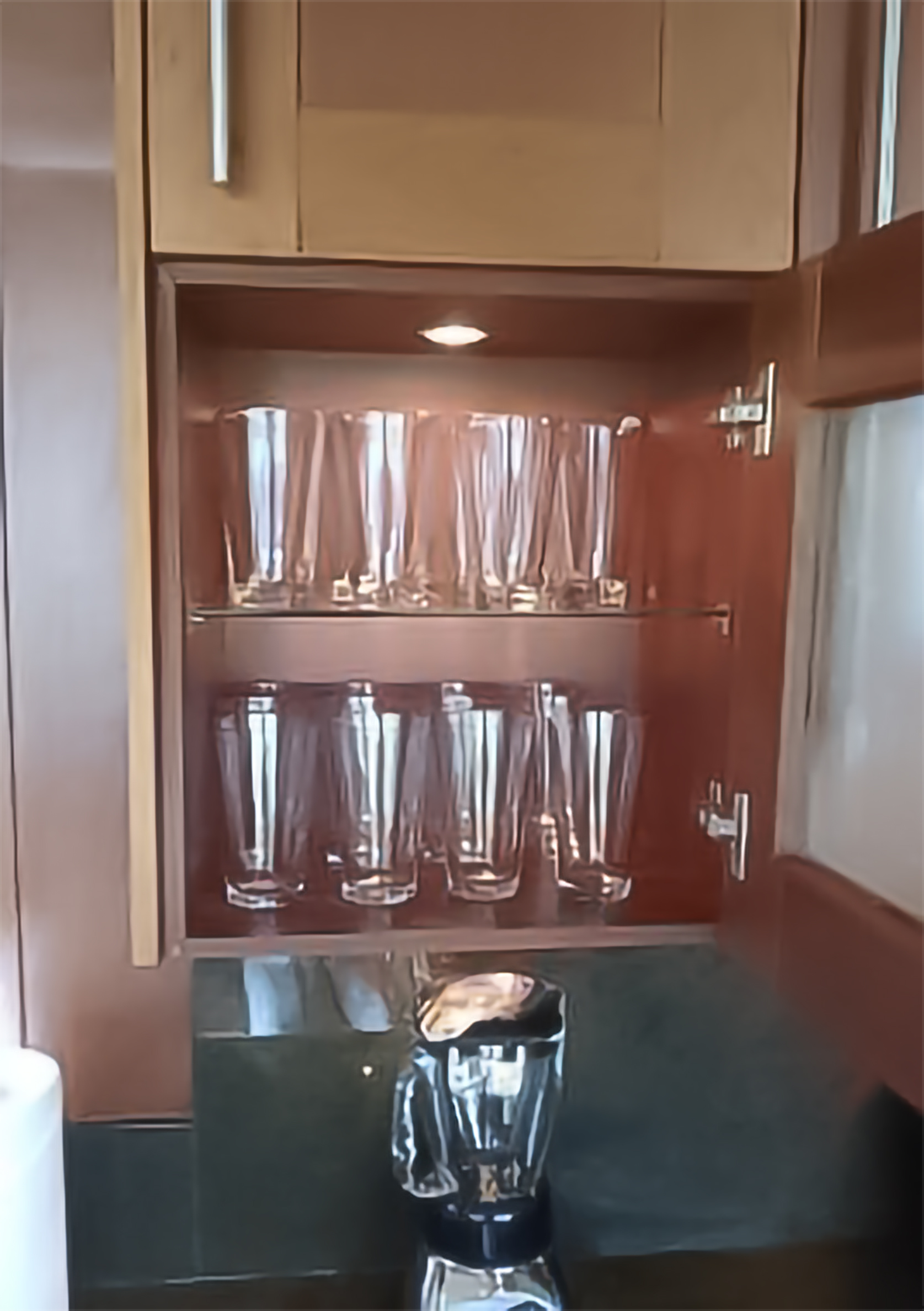 Perfectly organized glassware cabinet — vacation rental cleaning